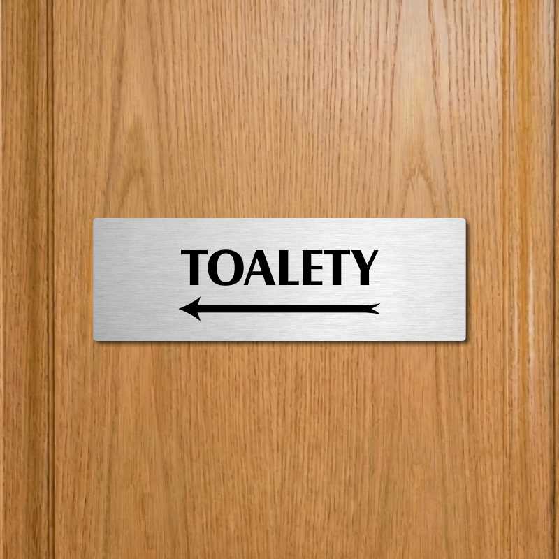 Toalety vlevo, 240x79mm, stříbrná popiska 